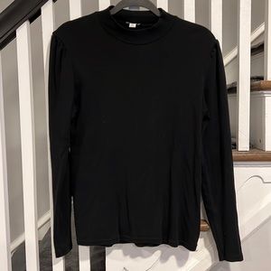 Mock turtle neck with slightly puckered shoulders